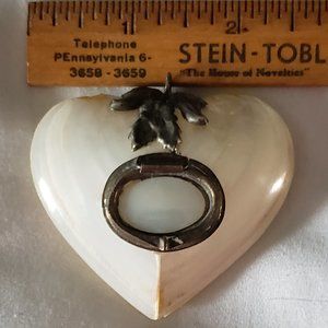 Vintage M O P pendant .2 3/4 across." opens for "storage"